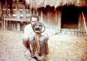 Papua, New Guinea - a villiager with his mummified mother